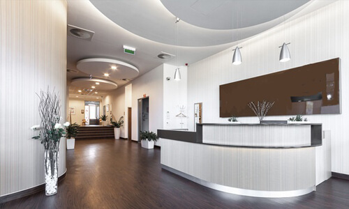 Picture of a dental office interior representing the dental services of the Costa Rica Dental Center in San Jose, Costa Rica.  The interior is very modern and has soft brown and white colors.